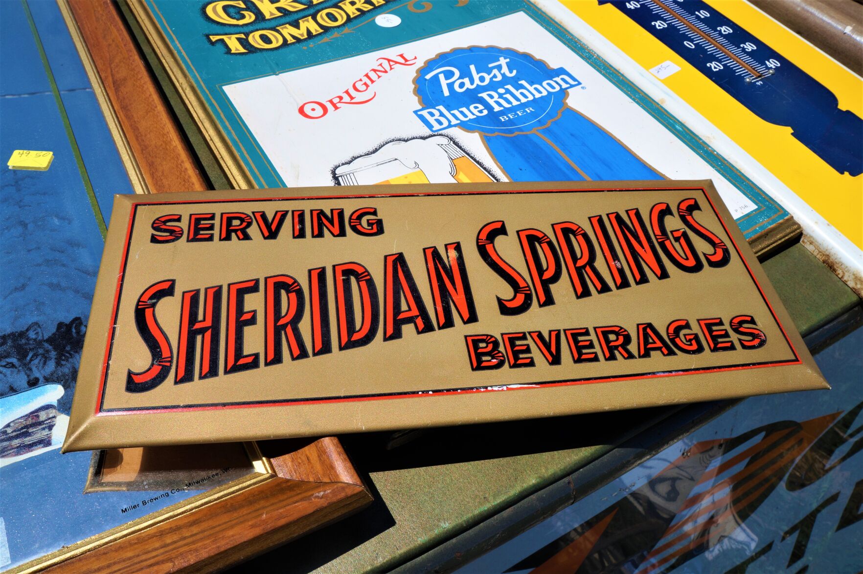 Sheridan Springs Beverages sign at the Elkhorn Antique Flea Market